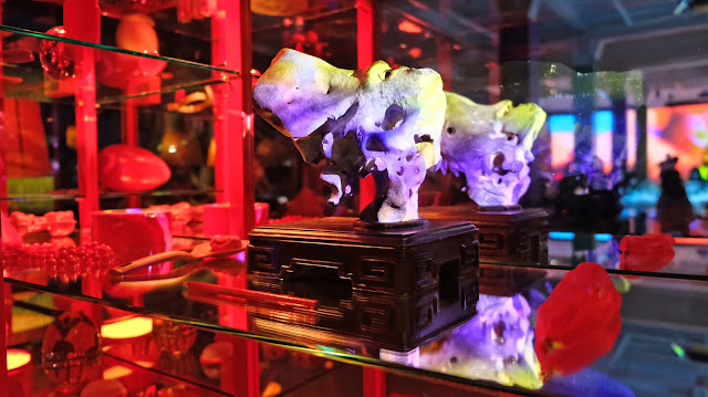 Scholarly Rock in a sideboard with a strange red lighting