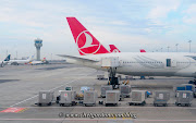 Turkish Airlines aircraft are serviced by ground personnel at Ataturk . (cgkenya)