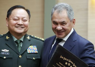 Lao and Russian Defence Ministers.  Source:  AP