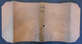 Plain jacket removed from book so flaps are shown. There is no type except the title, author and publisher on spine.