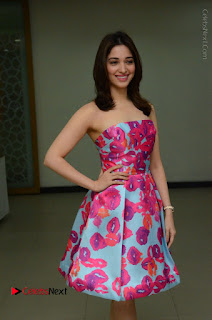 Actress Tamanna Latest Images in Floral Short Dress at Okkadochadu Movie Promotions  0040.JPG