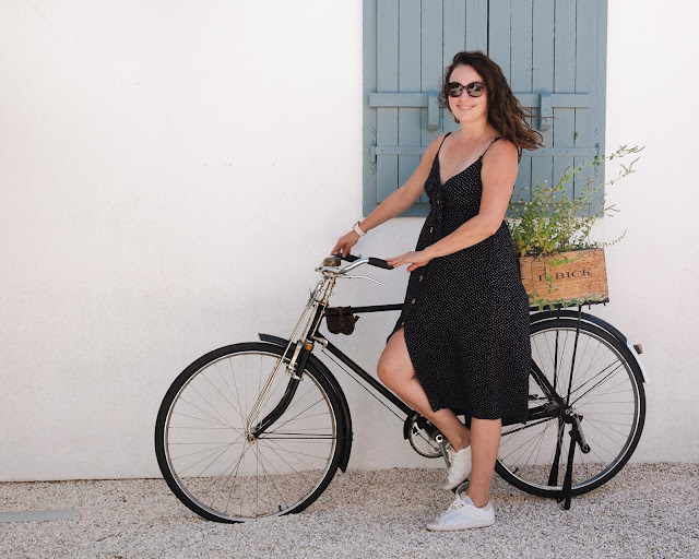 Beautiful woman posing with bicycle at Bibich Winery