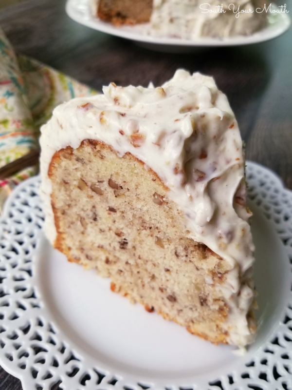 Pecan Cream Pound Cake with THE BEST Pecan Cream Cheese Frosting | A decadent Southern pound cake recipe made with sour cream and pecans topped with an ultra creamy pecan-studded cream cheese frosting that will have folks begging for the recipe!