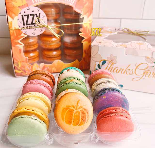 box of Izzy Macarons with a pumpkin imprint macaron features