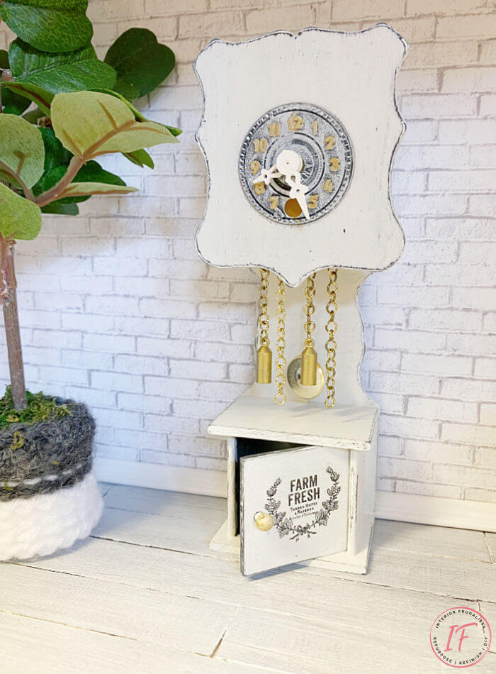 Two adorable DIY dollhouse miniature clocks in two different styles. An upcycled dollhouse farmhouse grandfather clock and a DIY dollhouse wall clock.