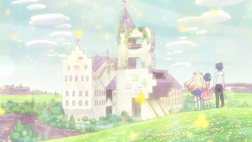 Three main characters stand on a clover-covered hillside with their backs to the viewer, looking out at the grand castle in the distance