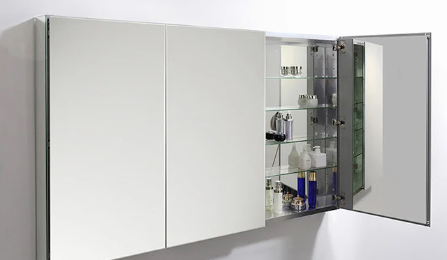 Three door medicine cabinet with mirror front and shelved inside.