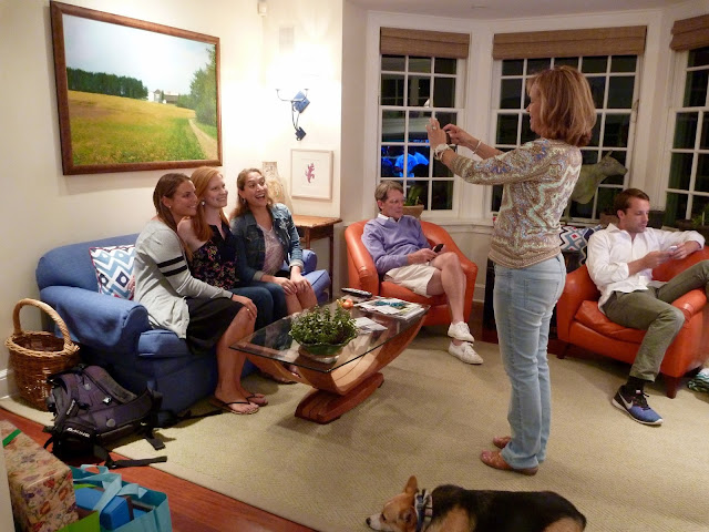 Woman photographing three women