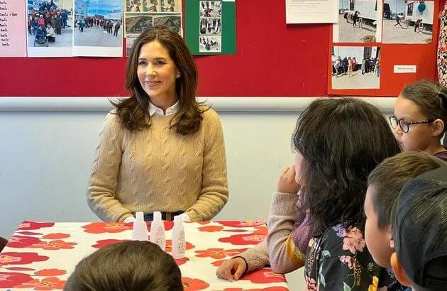 Crown Princess Mary wore a reversible coat by Massimo Dutti, and a new coat by Mackage, and beige wool cable knitted sweater