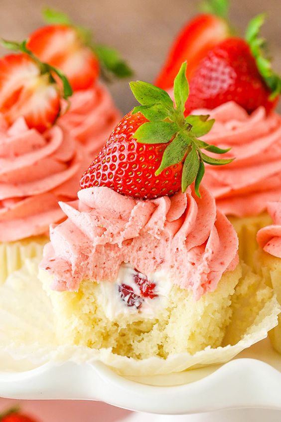 These Strawberries and Cream Cupcakes are made with moist vanilla cupcakes, fresh cream filling with chopped strawberries and the most amazing strawberry frosting! They are pure heaven and great for summer! I always look forward to strawberries being in season. I love their smell, I love their taste and I love to bake with them. … These Strawberries and Cream Cupcakes are made with moist vanilla cupcakes, fresh cream filling with chopped strawberries and the most amazing strawberry frosting! They are pure heaven and great for summer! I always look forward to strawberries being in season. I love their smell, I love their taste and I love to bake with them. …