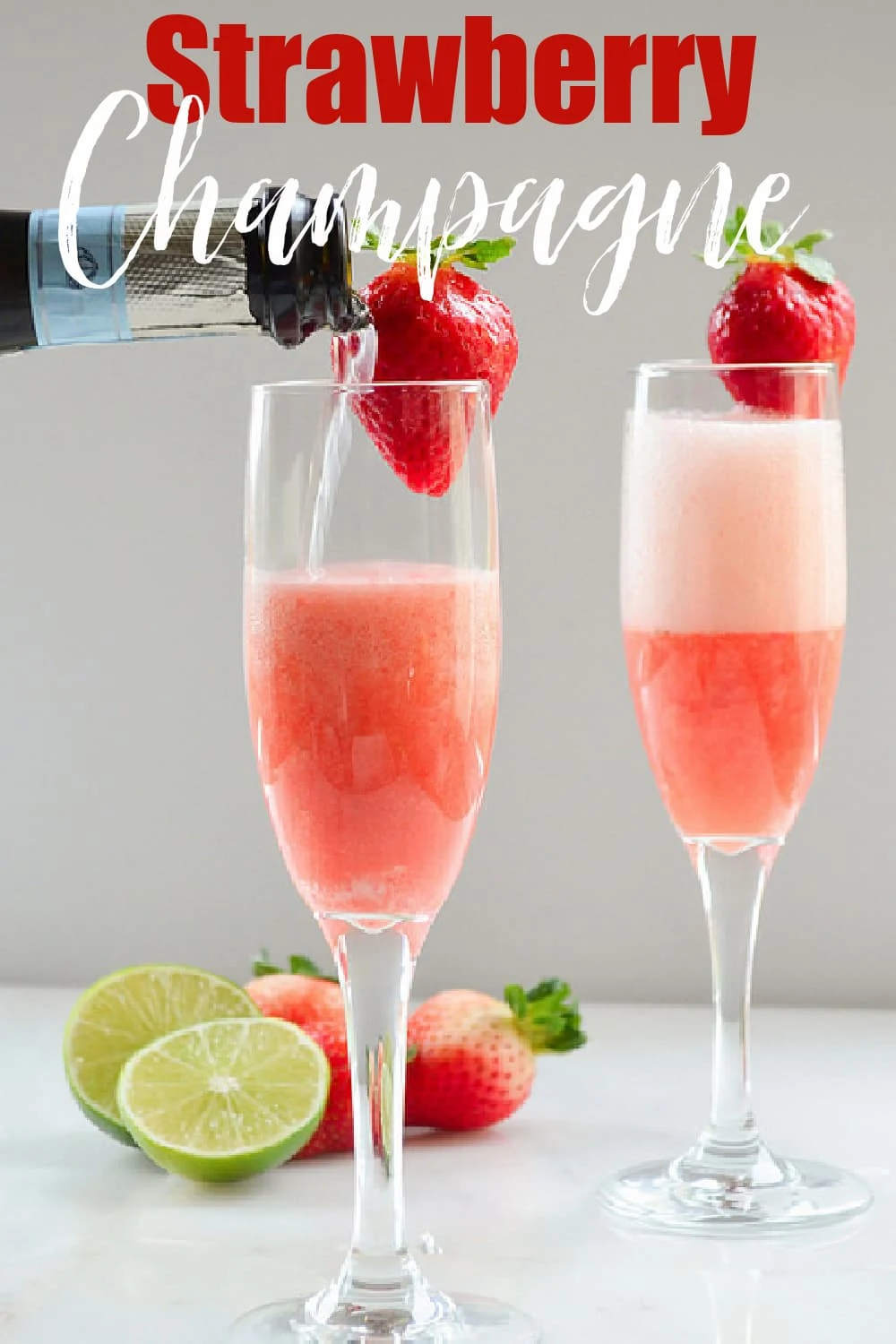 2 Glasses of Strawberry Champgne being topped off with a bottle of Champagne. Photo taken from the side.