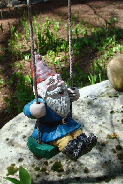 swinging gnome figure garden ornament