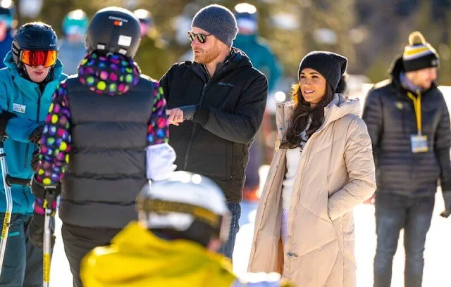 Meghan Markle wore a Barley maxi puffer jacket by Calvin Klein. Sorel Joan arctic boots. Co cashmere crew neck sweater