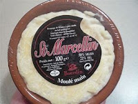 Saint Marcellin cheese in an earthen crock