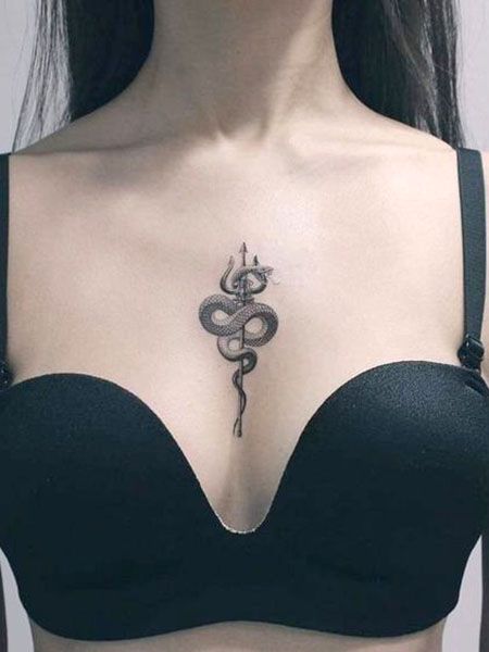 snake-around-trident-sternum-tattoo