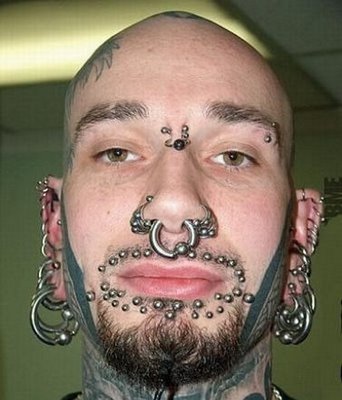 Xtreme body piercing tattoos face
