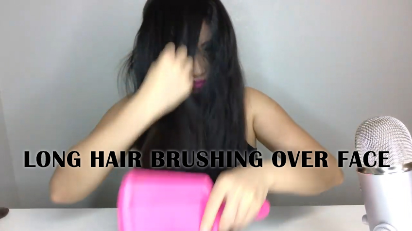 long hair brushing over face