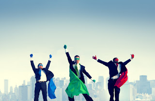 3 business men in super hero capes celebrate their selection through behavior-based interviewing training