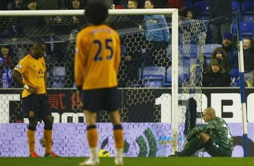 Everton goalkeeper Tim Howard reacts after conceding a bizarre own goal against Wigan