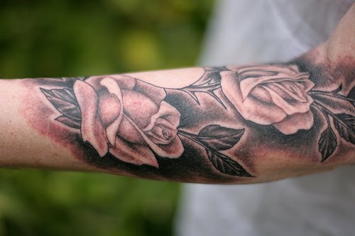 Forearm tattoo of roses