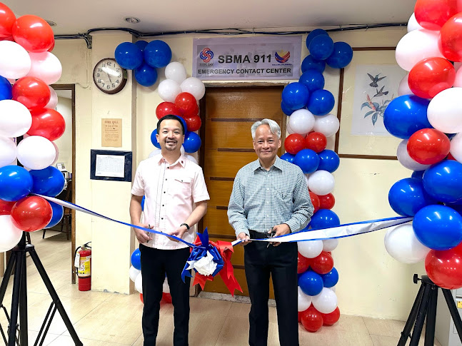 Subic Bay Metropolitan Authority (SBMA) Chairman and Administrator Jonathan D. Tan (left) joins Department of Interior and Local Government (DILG) Patrol 911 Executive Director Diosdado T. Valeroso in cutting the ribbon to inaugurate the SBMA 911 Emergency Call Center at the SBMA Regulatory Building in Subic Bay Freeport zone last Thursday (September 14).