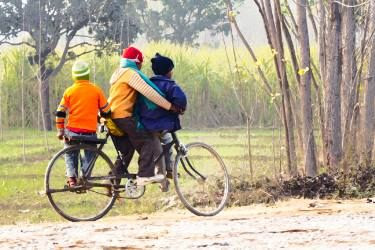 Saatchi art - 3 young children on a cycle at the side of the road - Prints 