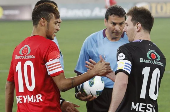 Lionel Messi and Neymar shake hands before a charity match in Lima, Peru