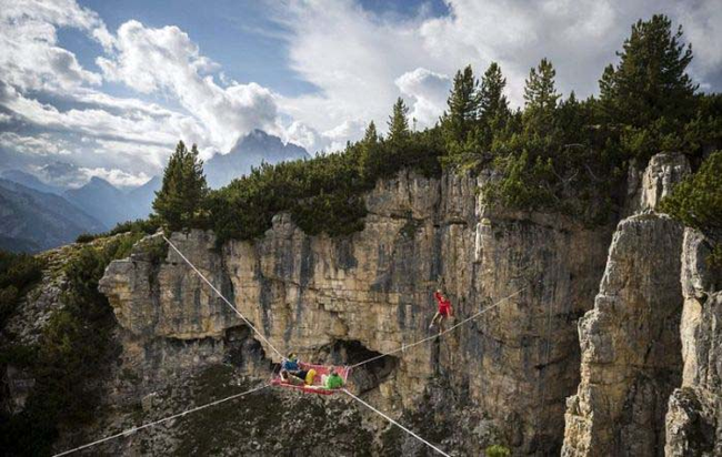 Nothing like having to tight rope walk in order to hang out with your friends. - Camping Is One Thing, But What These People Are Doing? It's Just Crazy.