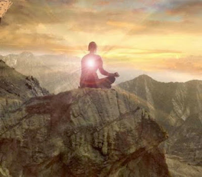 Man meditation on the edge of a cliff