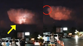 nel momento un gigantesco "UFO" apparso su una nuvola rossa nel cielo