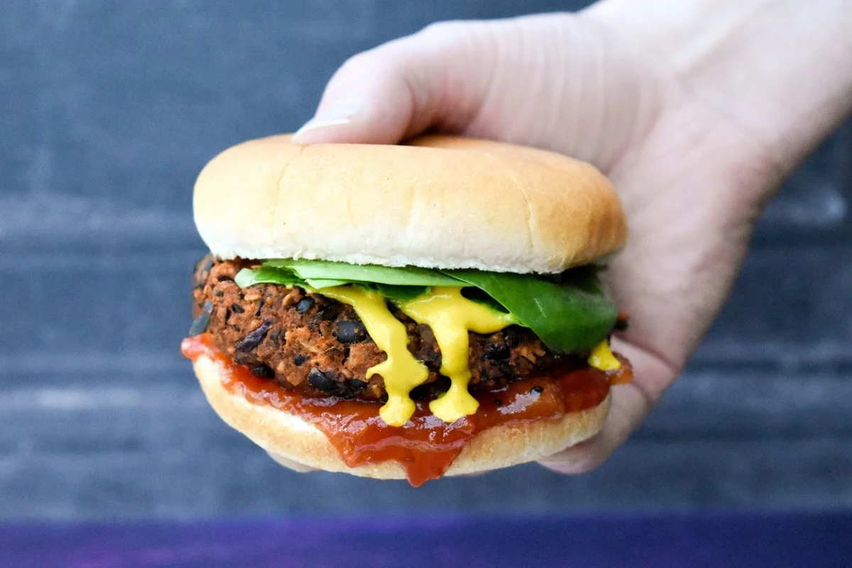 Black bean burger on a bun with toppings.