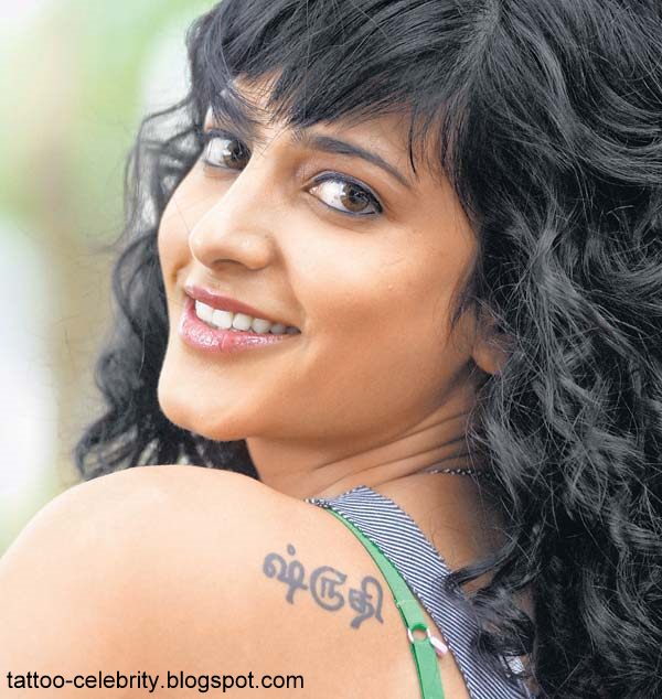 Shruti Hassan has a small text tattoo on her left back just below the neck