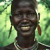 Maasai tribe woman in lush green forest…