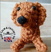 http://www.ravelry.com/patterns/library/teeny-tiny-daschund-amigurumi