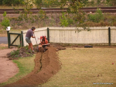 plumber digs our trench with ditchwitch