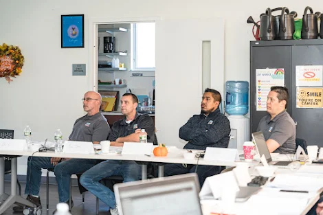 Maintenance managers sitting and listening at training