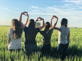 Teen girls in a field together