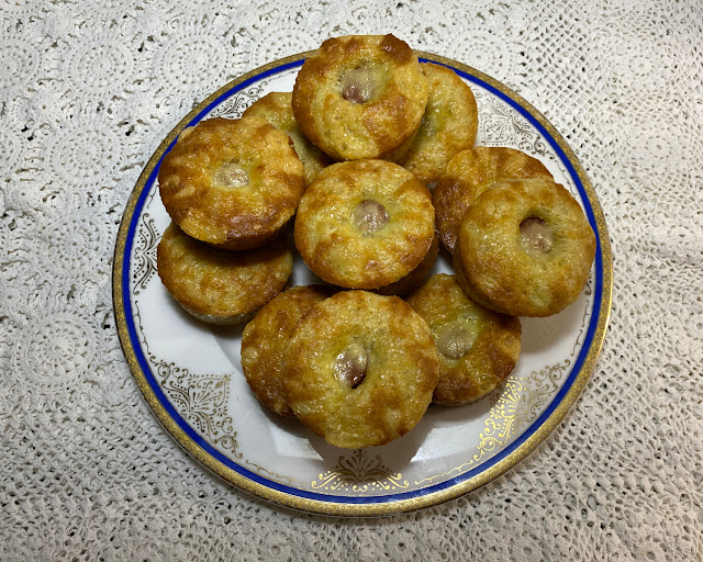 Plate of freshly baked low carb cheddar corn dog muffins