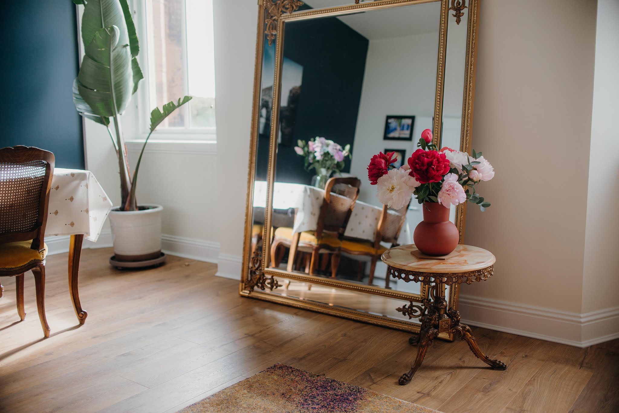 living dining room reveal large mirror antiques peonies plants liquid grain