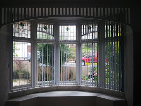 Bay window curved vertical blinds by Blindology Blinds of Plymouth