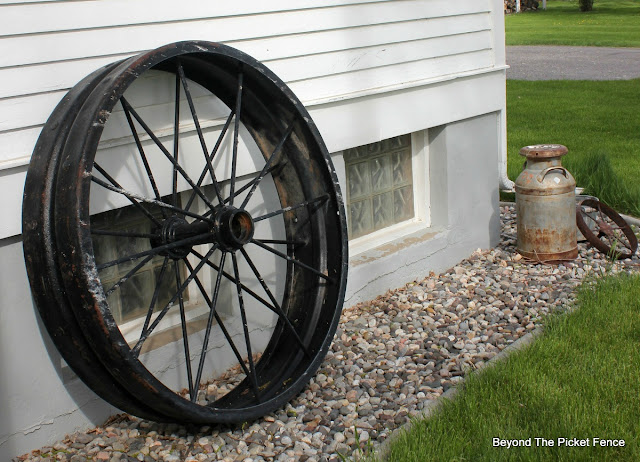 tractor wheel, garden junk, old schoolhouse, http://bec4-beyondthepicketfence.blogspot.com/2016/05/junk-planters.html