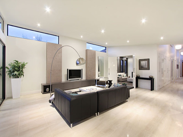 Picture of black leather sofa in the living room of small contemporary home in Melbourne