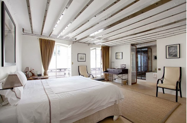 White and taupe bedroom in a Paris apartment 