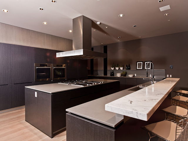 Photo of modern kitchen interiors with dark brown furniture