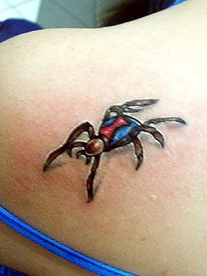 small spider tattoo on upper shoulder girls unique tattoo