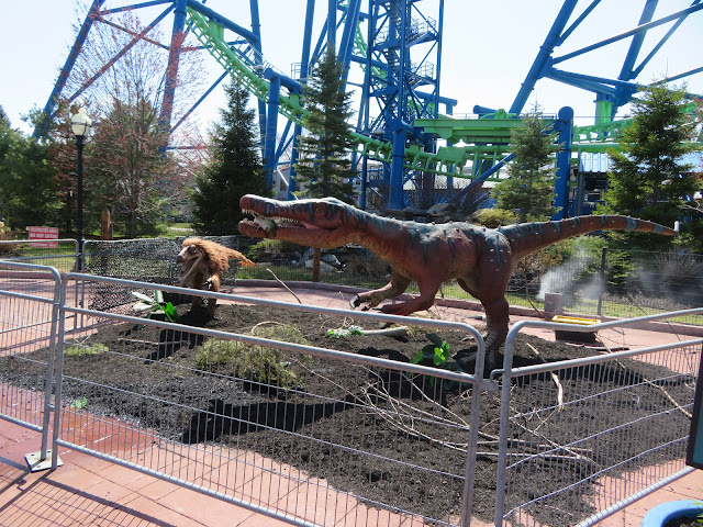 Dinosaur Animatronics In Front of Goliath Roller Coaster Six Flags New England