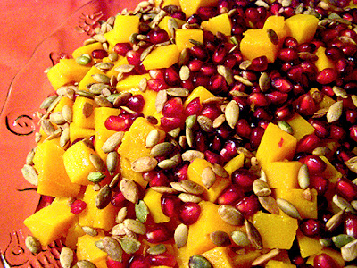 Plate of Roasted Butternut Squash with Pomegranate abd Pumpkin Seeds