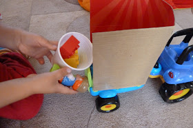 Child playing with ELC tractor toy