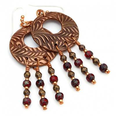 The beautiful copper hoops have a raised flowing fern frond design for lovely texture.