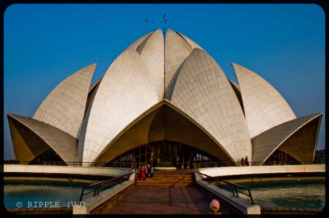 A good place to visit in Delhi : Lotus Temple @ Nehru Place, Delhi, INDIA: Here are some some miscellaneous shots of Lotus Temple. The construction of the temple is similar to that of the Opera House in Sydney. The temple always looks mesmerizing. However, different light conditions have different effect on the way the temple appears.: Posted by Ripple (VJ) on PHOTO JOURNEY @ www.travellingcamera.com : ripple, Vijay Kumar Sharma, ripple4photography, Frozen Moments, photographs, Photography, ripple (VJ), VJ, Ripple (VJ) Photography, Capture Present for Future, Freeze Present for Future, ripple (VJ) Photographs , VJ Photographs, Ripple (VJ) Photography : A couple enjoying the serenity of the temple @ LOTUS TEMPLE, Nehru Place, Delhi, INDIA